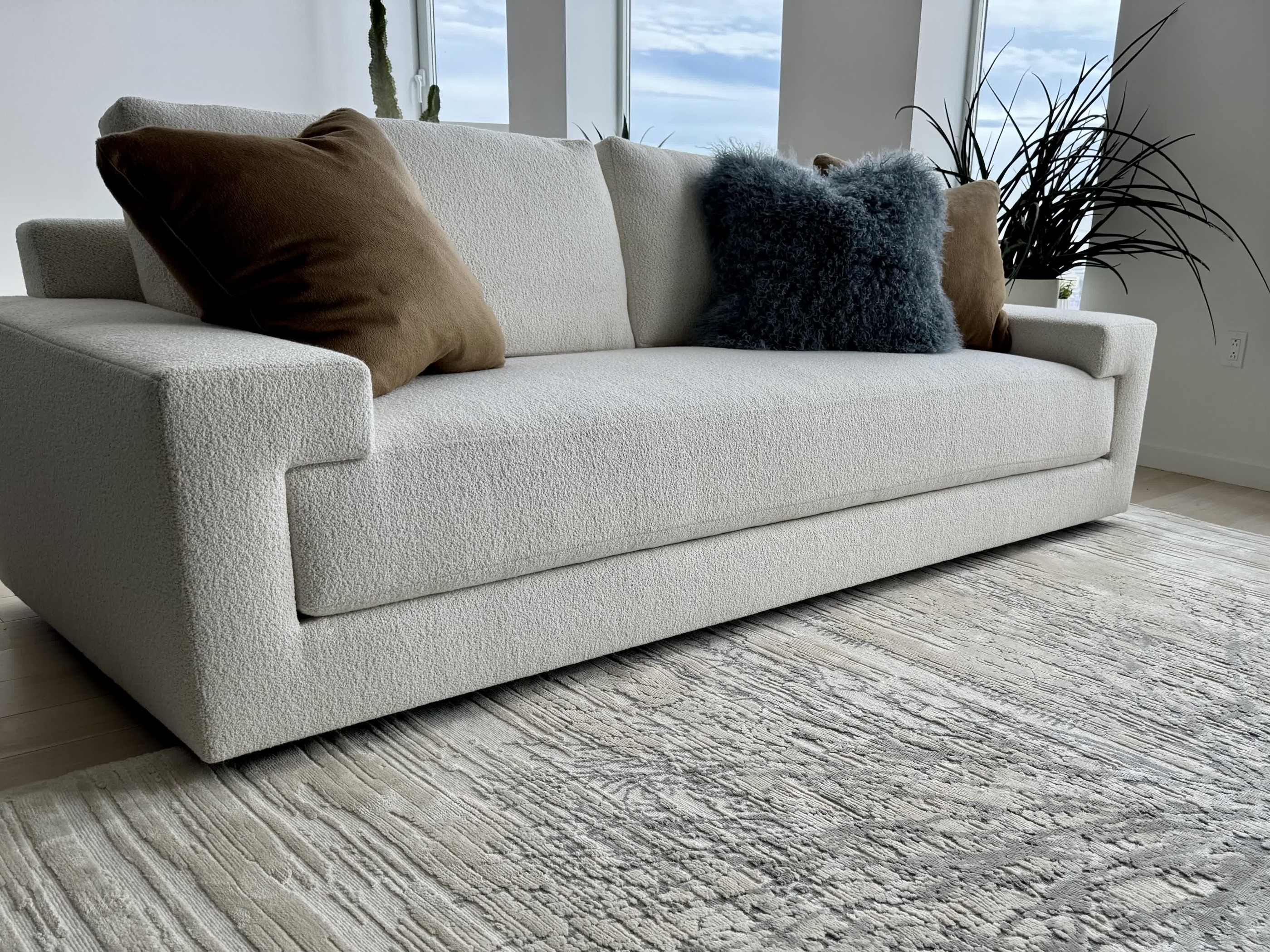 Tailored ivory sofa with textured cushions