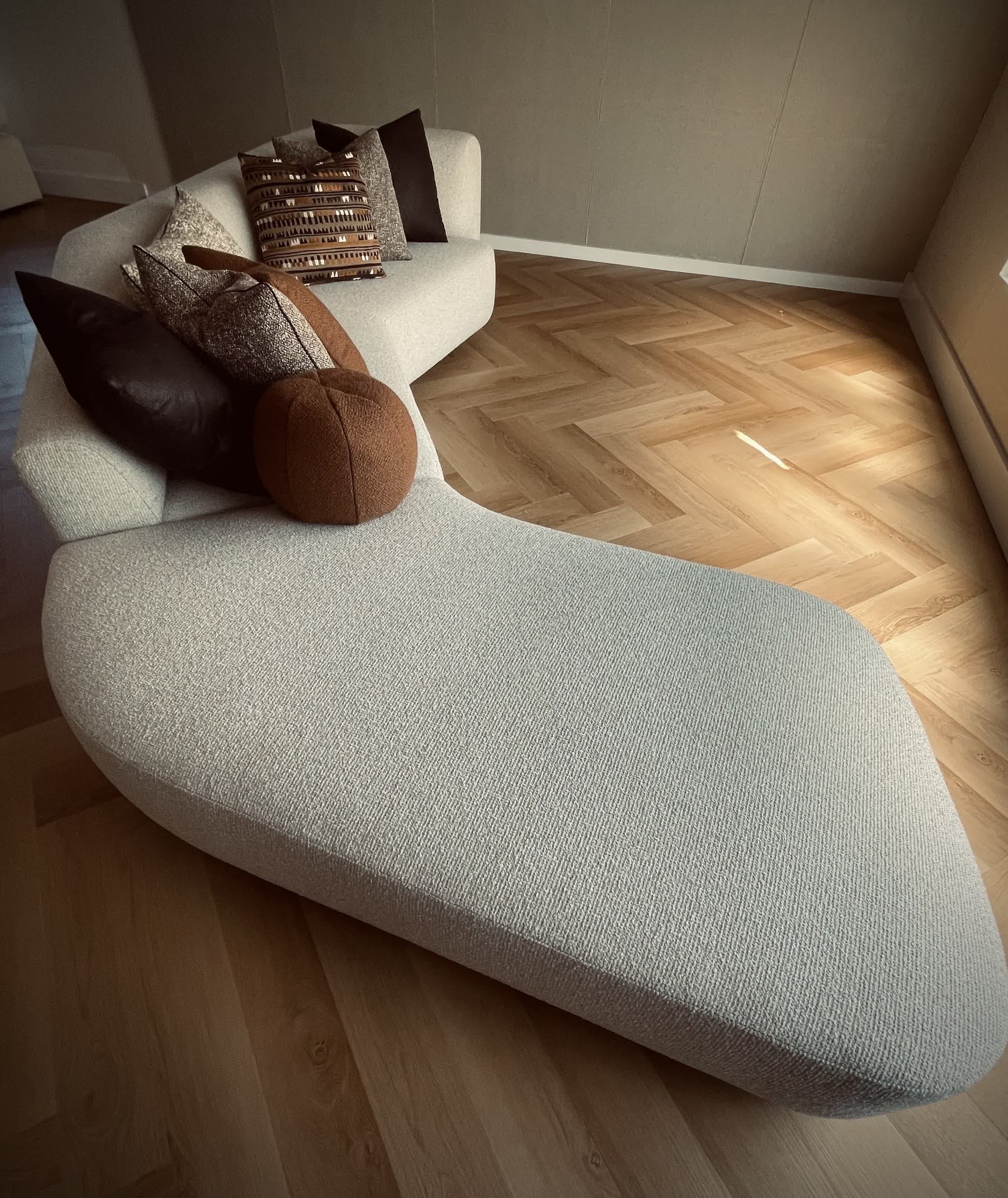 Sculptural cream sectional and chaise